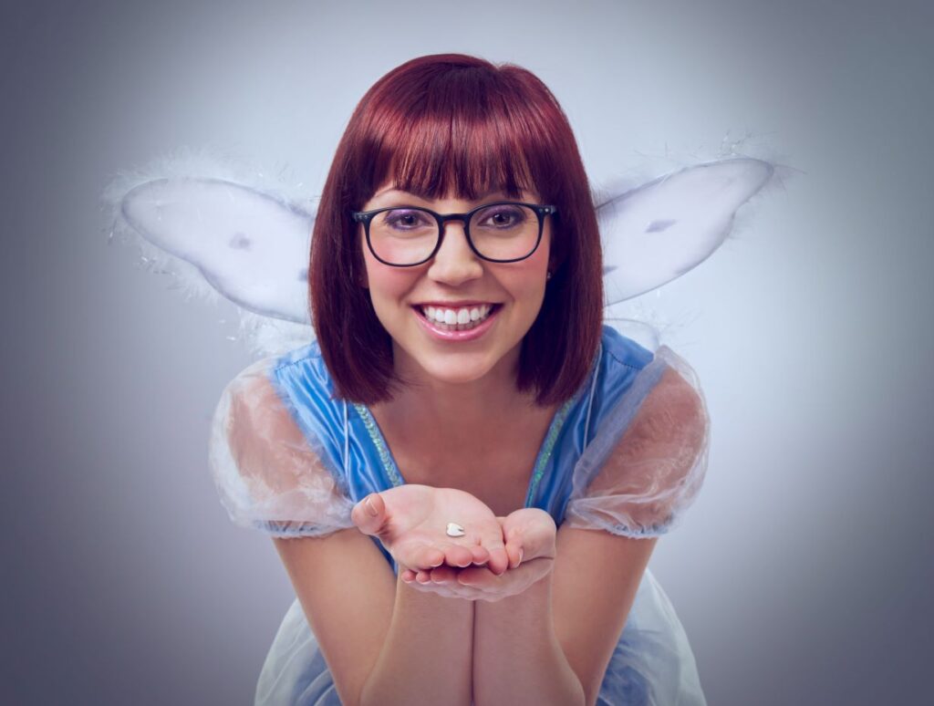 A woman in a tooth fairy costume.